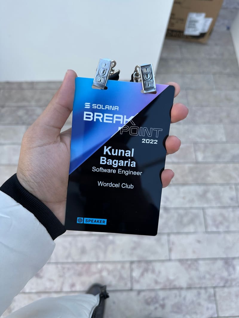 Kunal holding his Breakpoint 2022 speaker badge: Kunal Bagaria, Software Engineer, Wordcel Club.